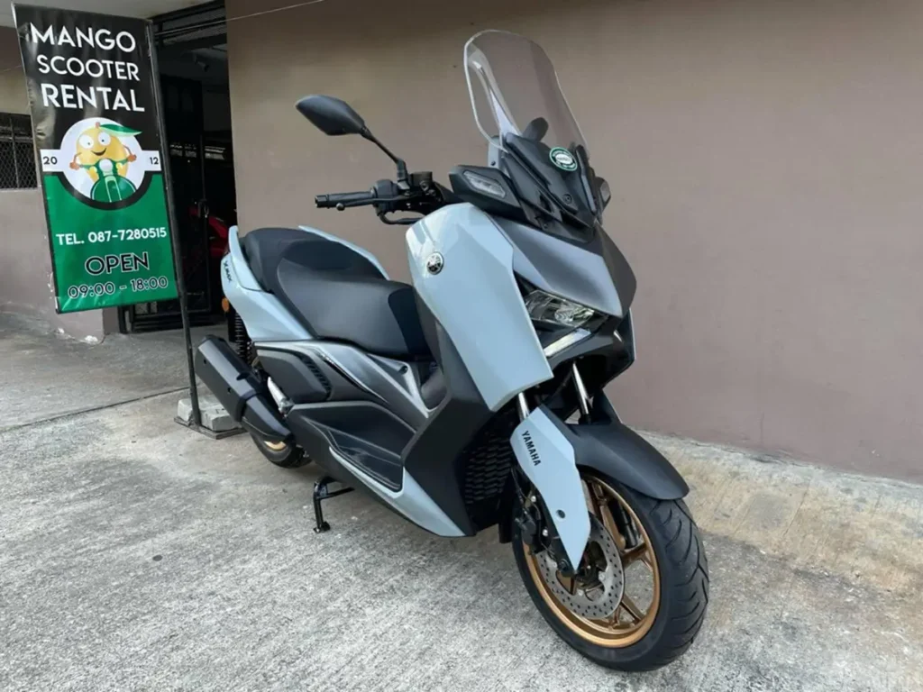 Yamaha Xmax scooter parked outside Mango Bikes scooter rental in Chiang Mai.