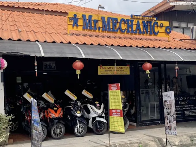 Scooters parked outside Mr Mechanic scooter rental shop in Chiang Mai.