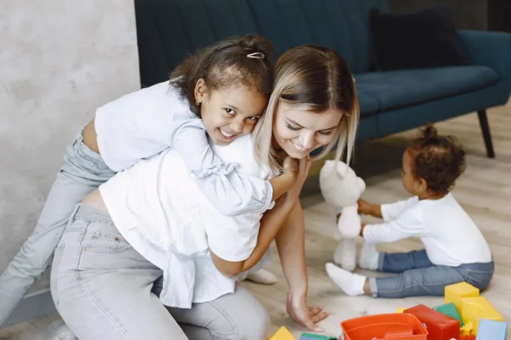 Au pair playing with children